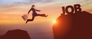 The Job Retention Scheme Extension - woman leaping from a rock to another rock with the word Job on it